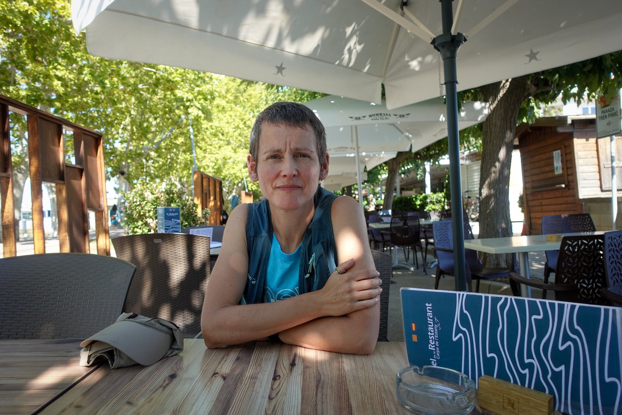 Clare sitting outside a cafe