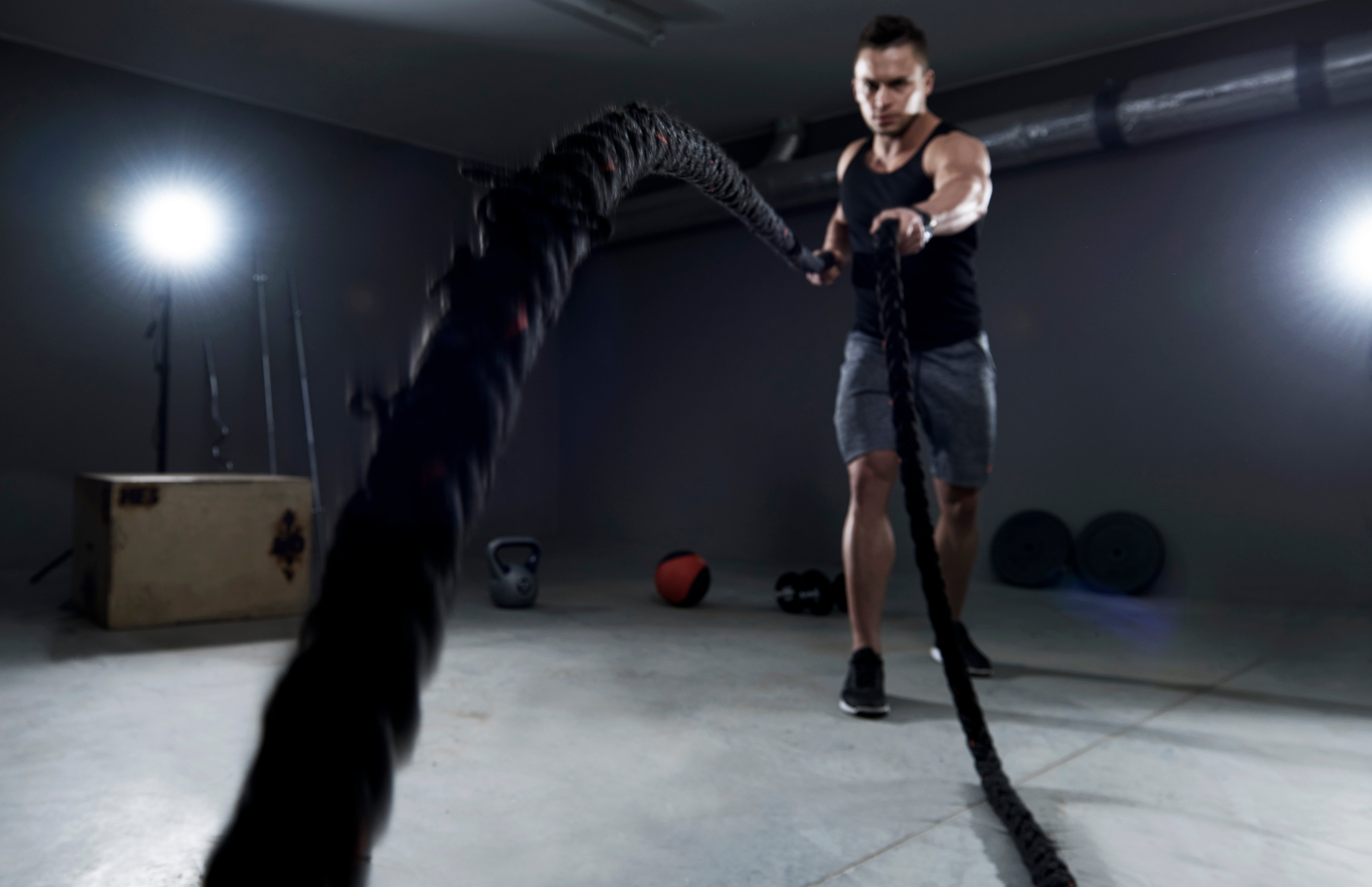 battle-ropes-exercise-in-the-garage-SBI-328453070